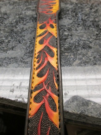 Custom tooled leather dog collar from acrossleather with flames and skull tooled.